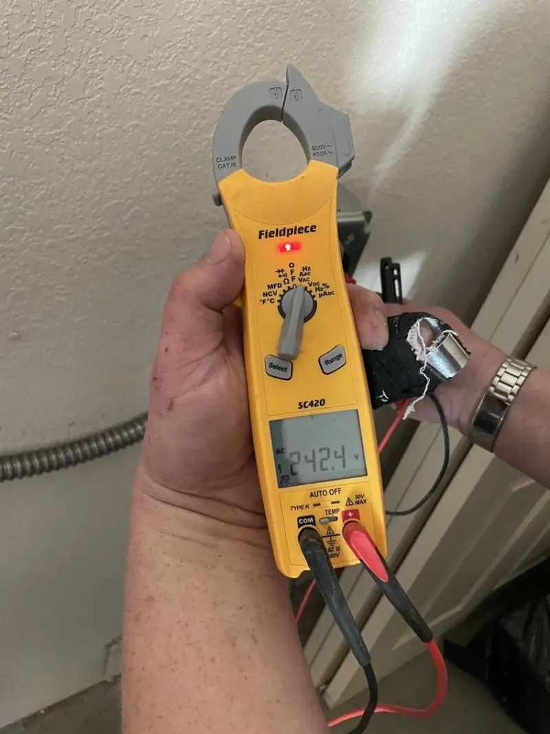 Voltage testing with clamp meter during Ceiling Fan Installation in Paragould
